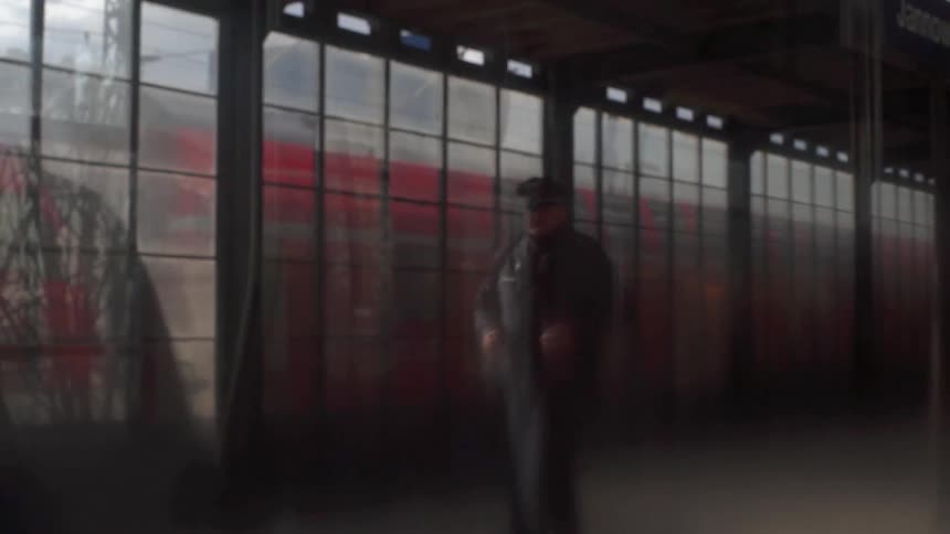 Police officer walking in a train station