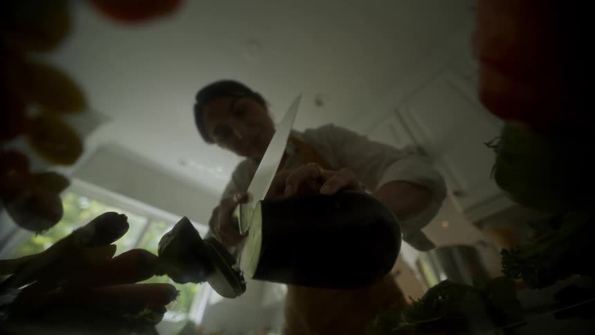 Woman cutting vegetable