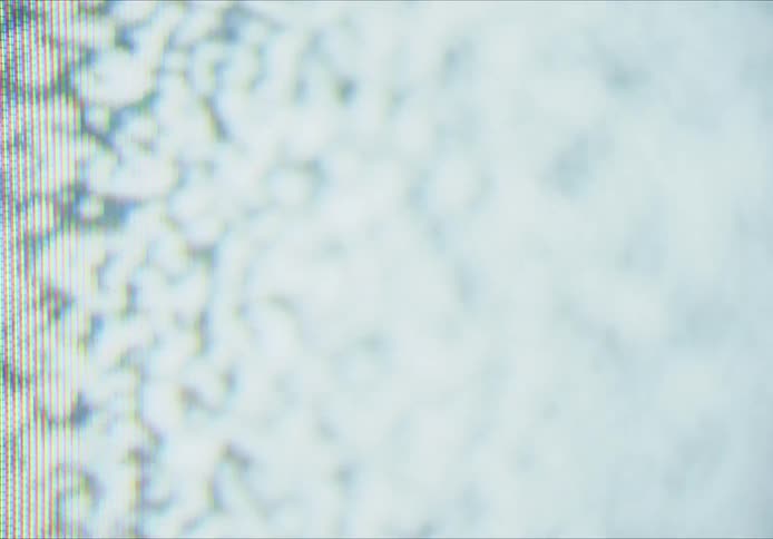 An abstract video of various black and white dots with lines running across what appears to be a pixelated screen