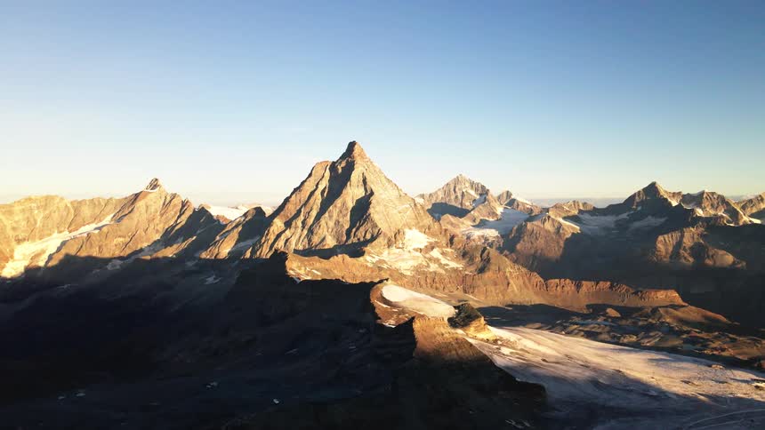A landscape of rocky mountains with ice on a sunny day