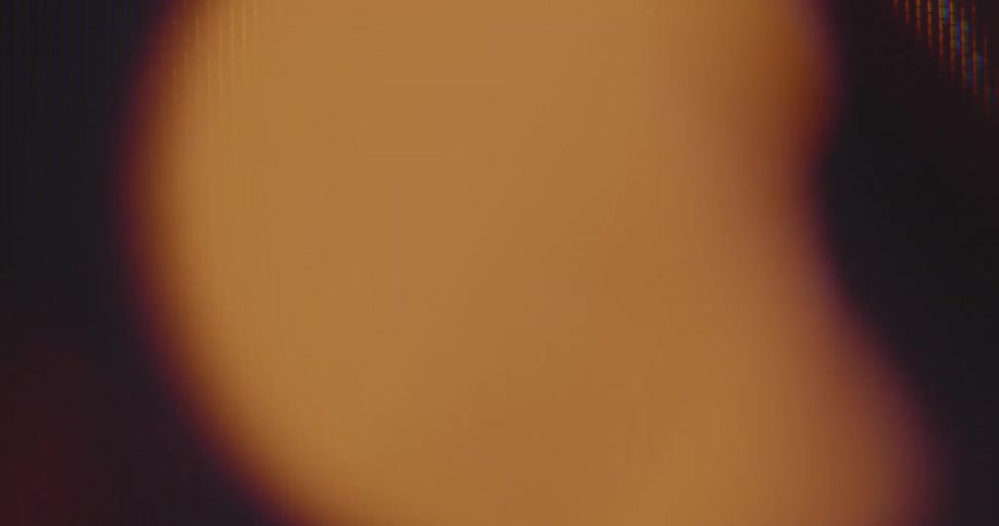 The orange signal light is flashing and pulsating on a pixelated vintage computer screen or display as a digital warning signal or alarm causing stress hectic and awareness that something is wrong