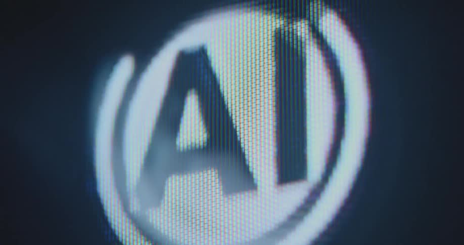 A computer-generated graphic about artificial intelligence is animated and flashing on the screen with black background representing the power of AI robotics machine learning and computer science