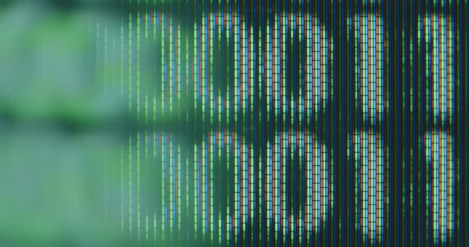 Extreme macro close up of the binary numbers 0 and 1 of a search algorithm flash on the display while constantly changing during data analysis based on information science and innovative computer programming technologies