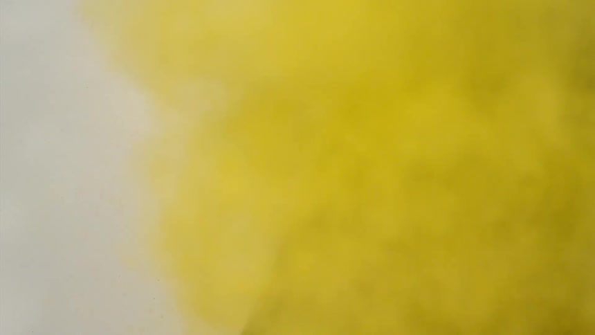 Yellow dirt flies from a black area