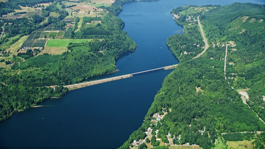 Aerial view of Mayfield Lake in Washington during the summer showcasing the Highway 12 bridge and the beautiful countryside surroundings