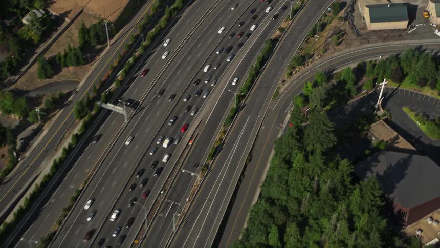 Aerial footage capturing heavy highway traffic in Southwest Portland Oregon during daylight hours