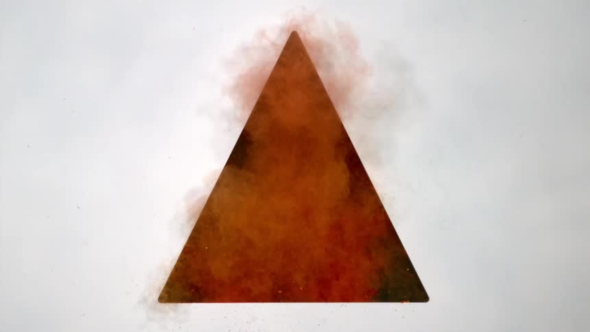 Red powder billows up in a dark triangle cut in a panel