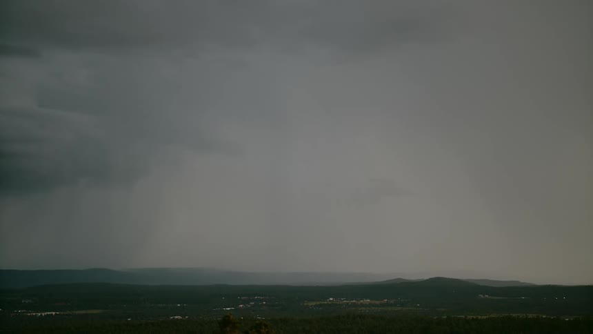 A lightning storm striking down on the horizon in the distance