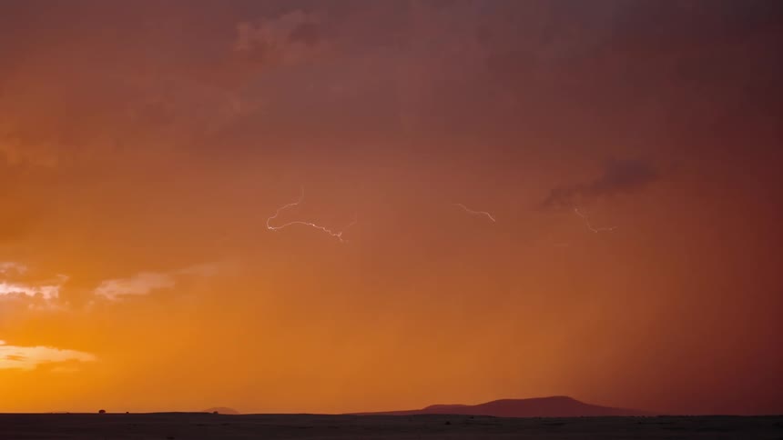 Lightning moves through the storm clouds