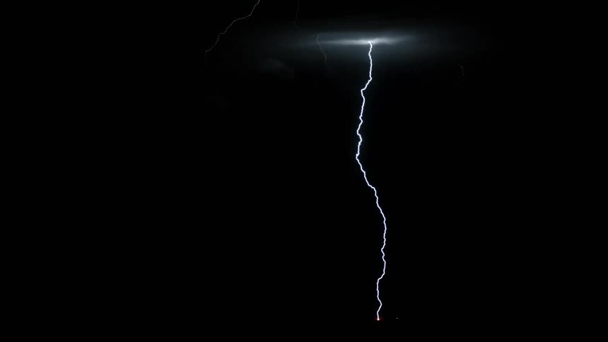 White rays cutting through the sky in the dark night