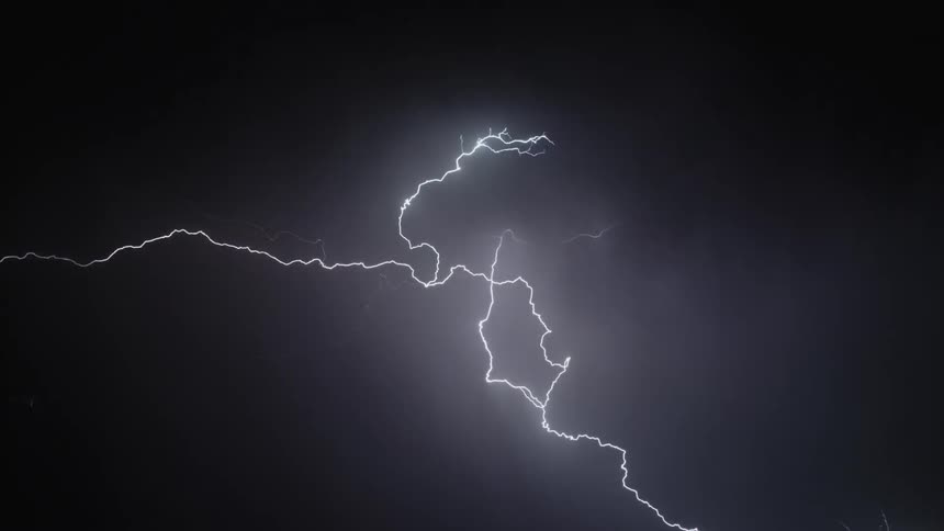 Cloudy sky with thunder and white lightning shining