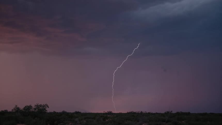 Purple sky with heavy clouds and strong thunder
