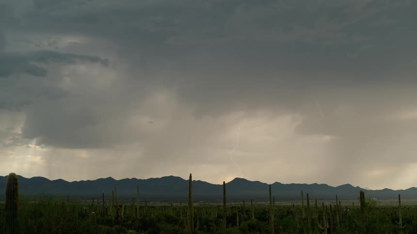 Sky darkening with thunder under the mountains