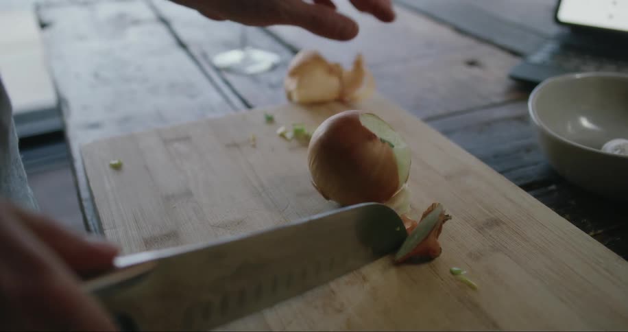 Chopping onions on a cutting board