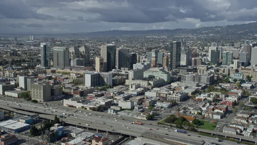  aerial footage of downtown office buildings in Oakland California captured during a sunny day in the Bay Area