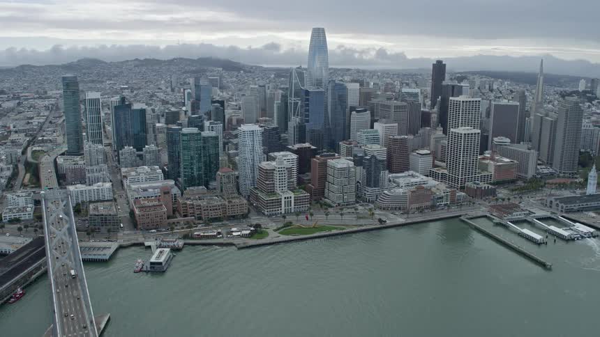  aerial footage of Downtown San Francisco skyscrapers in California showcasing the city's high rises and bustling downtown area on a cloudy day