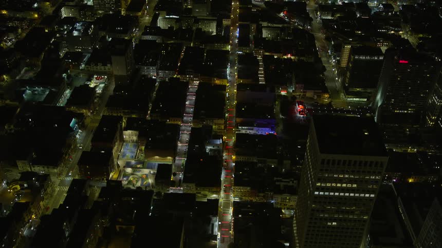  aerial stock footage showcasing an tilt from a bird's eye view overlooking Grant Ave in Chinatown at night San Francisco California with clear skies and a vibrant city streets ambience