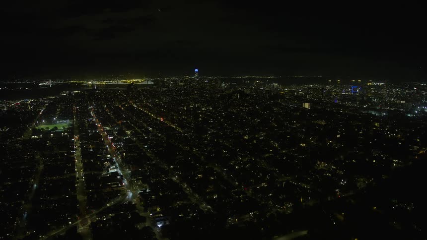  aerial footage showcasing the illuminated cityscape of Downtown San Francisco at night captured from the Marina District with clear skies and a wide-angle view highlighting the beauty of the Northern California city | Tags: night clear skies downtown cit