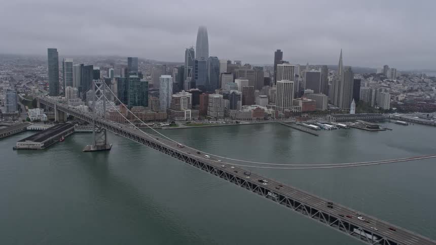 A stunning aerial shot of Downtown San Francisco on a foggy day captured from the Bay Bridge in California