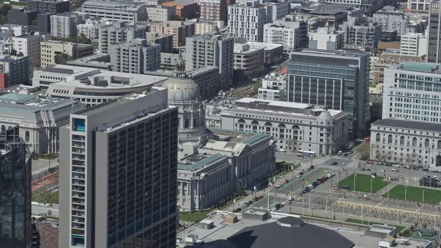  aerial footage capturing a side view of San Francisco City Hall in Civic Center bathed in sunshine during a summer day