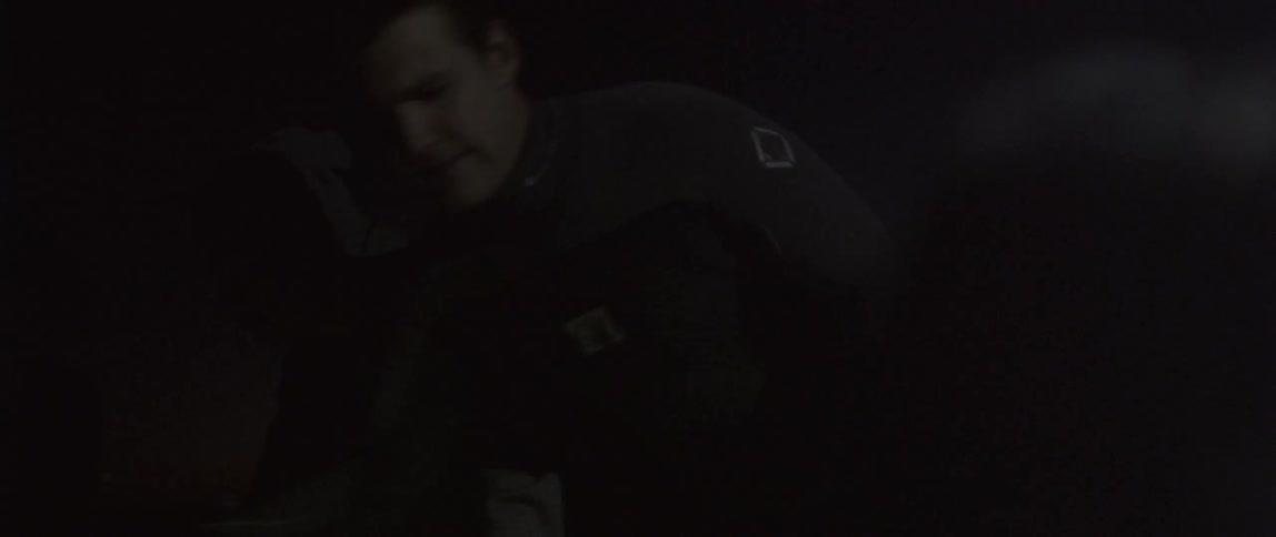 People are working in the dark looking through stuff