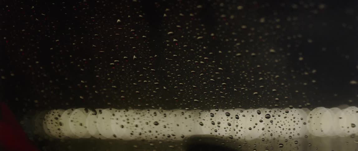 Water droplets cover a window