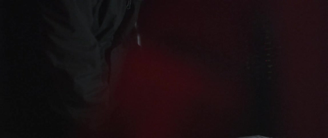 A leans forward looking for something in the dark