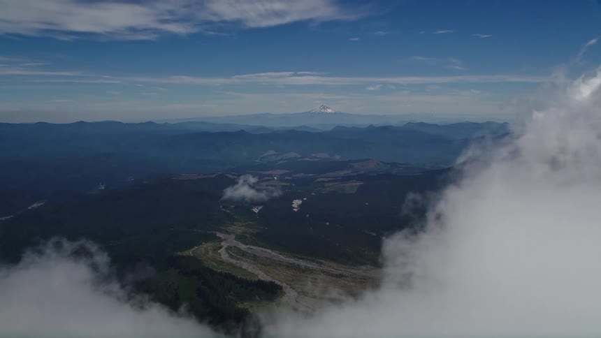  aerial footage unveils Mount Rainier emerging through white clouds in the Pacific Northwest Washington