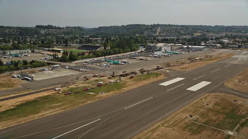 Aerial footage of a plane taking off from Renton Municipal Airport in Washington during daytime