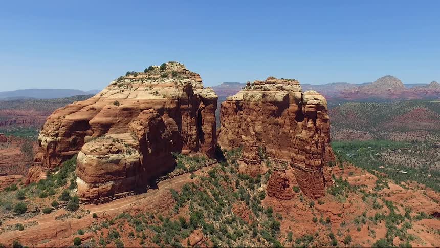 Aerial view of a trail going through a mountain range