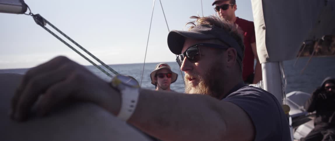 Men are on a boat talking