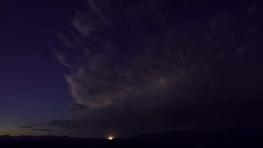 Thunderstorm over a road in the countryside at nightfall