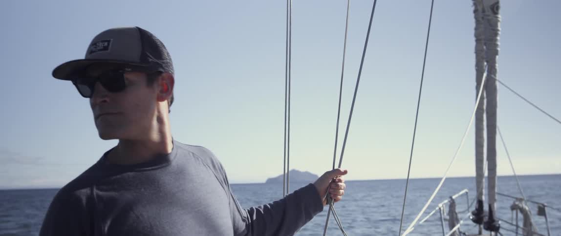 A man is riding a boat