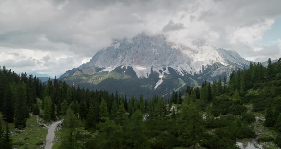 An aerial view of the woods and mountain