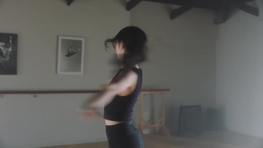 Female dancer performing indoors during day time