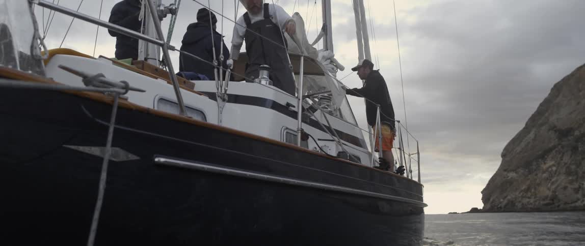 People are on a boat as it rocks in the water