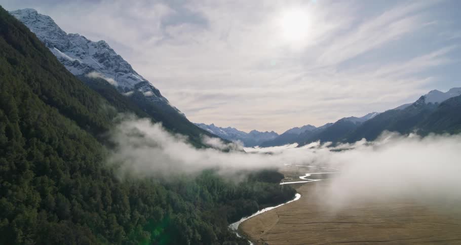 An aerial view of the green forest and hills