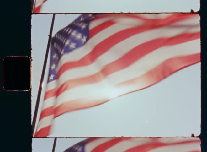 Vintage film footage with nostalgic vibe of the American USA national flag moving and waving in the strong wind on flagstaff as a symbol for patriotism pride and proudness of Americans loving their fatherland or homeland