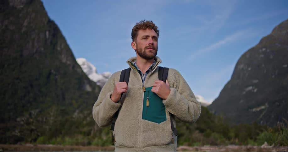 Man stands alone in the middle of nowhere with a backpack