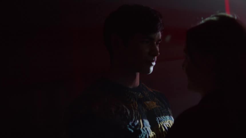 Man and woman looking at each other face to face smiling