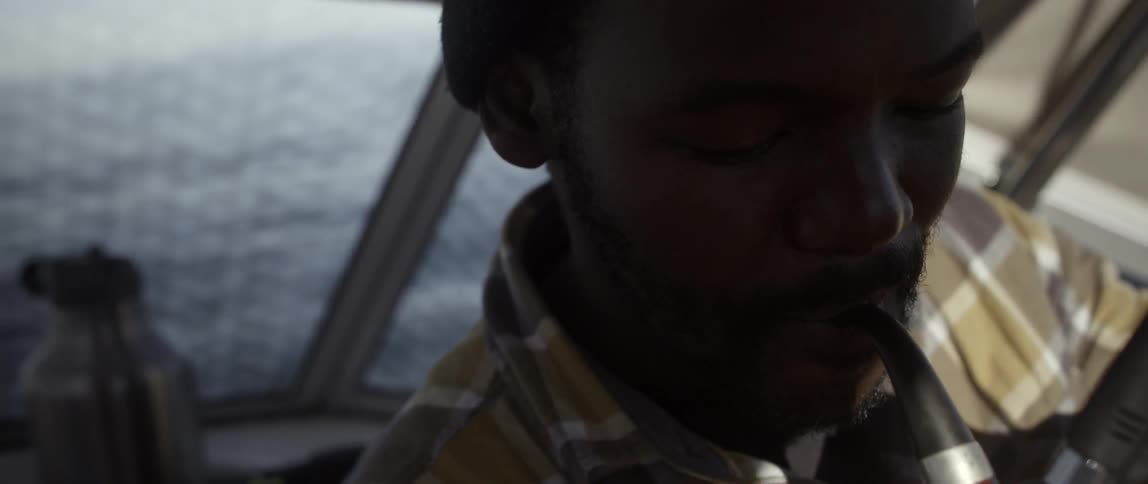 A man is smoking a pipe