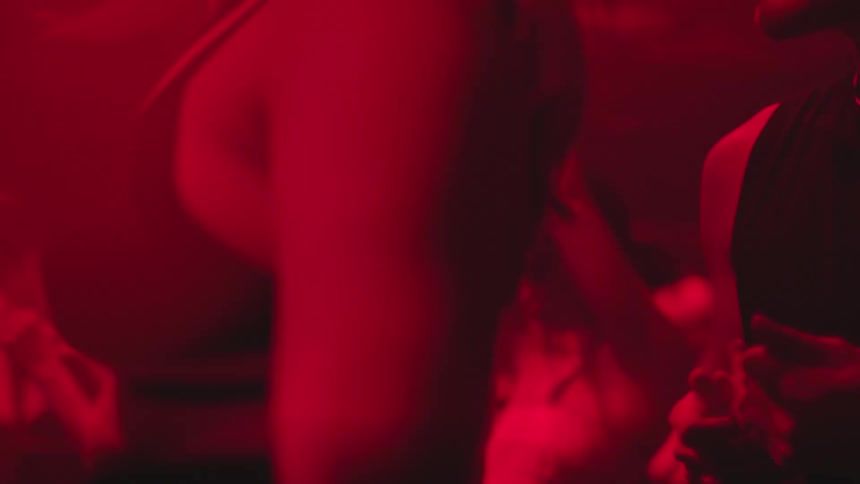 People dancing in a nightclub environment