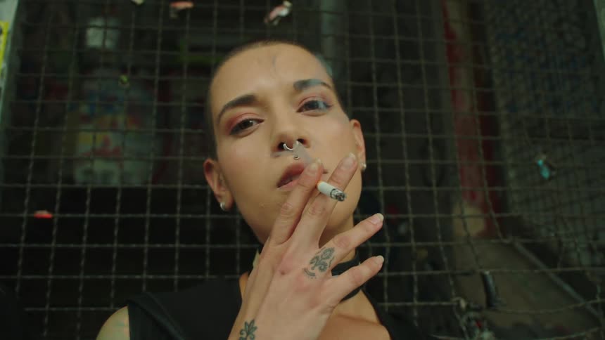 Closeup of a young woman smoking a cigarette
