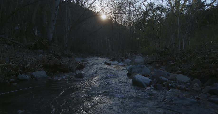 Morning sunlight on a hill shine over a river