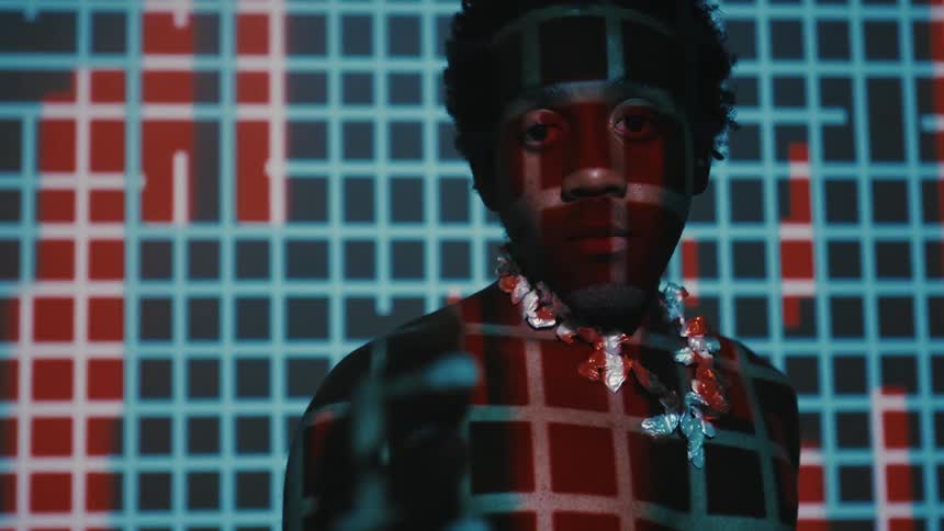 A black man contemplates digital consciousness as he encounters artificial intelligence