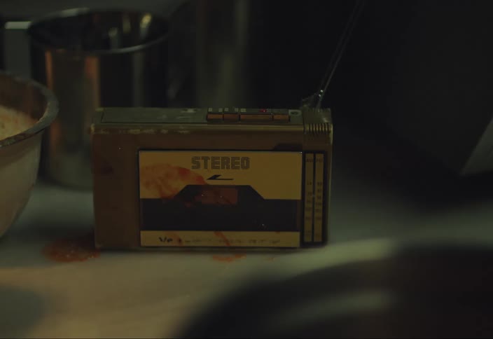 A red liquid falls onto a retro radio set