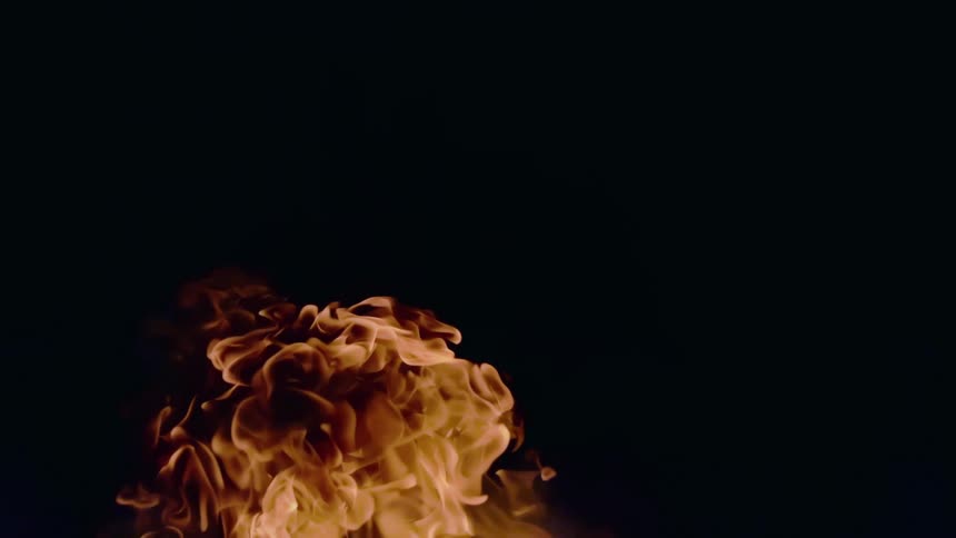 Yellow flames rise against a black background