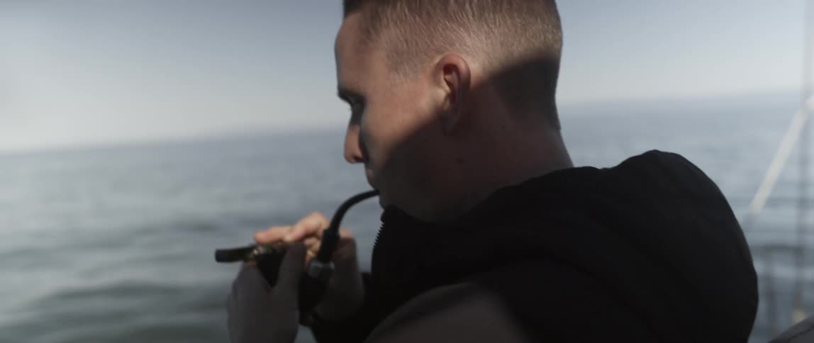 A man lights his pipe
