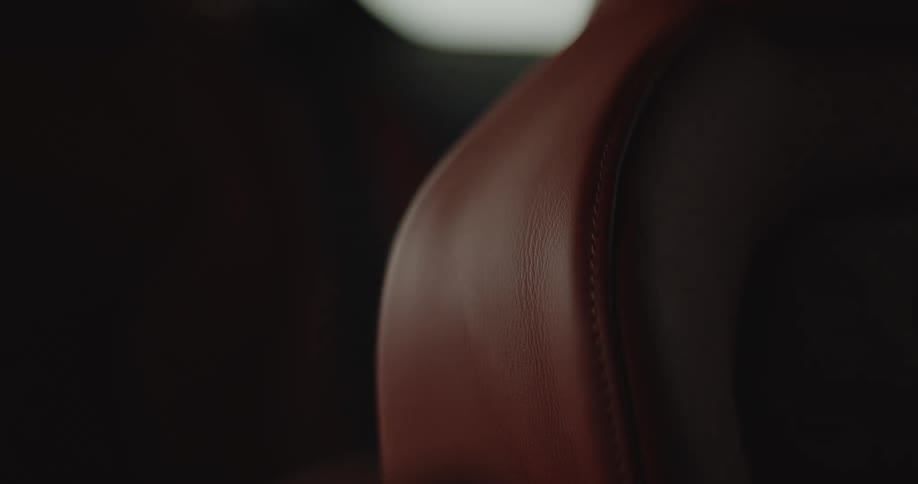 A stitched leather seat with day and night lighting and shadows