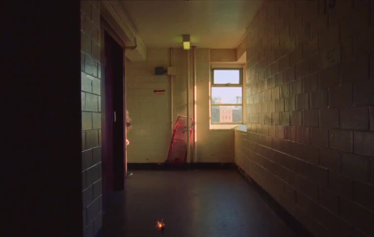 A child throws a bomb in a building hallway
